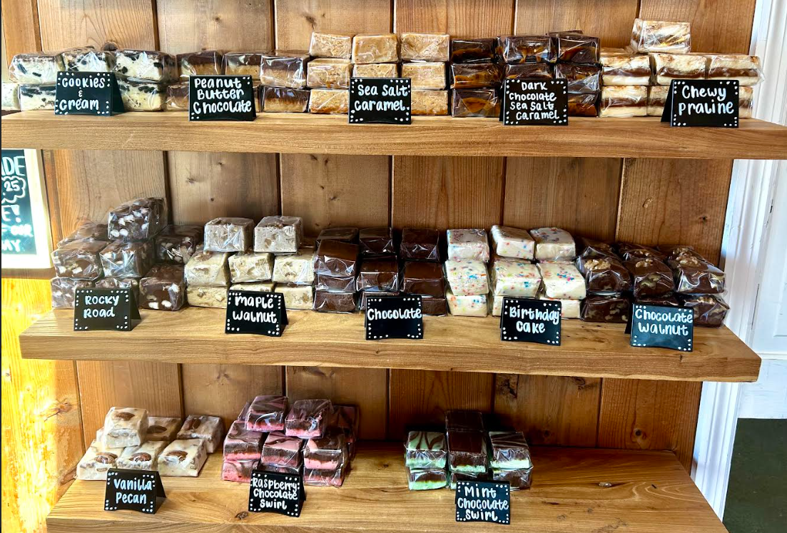 Wooden shelves of homemade fudge flavors at The Birds Cafe coffee shop