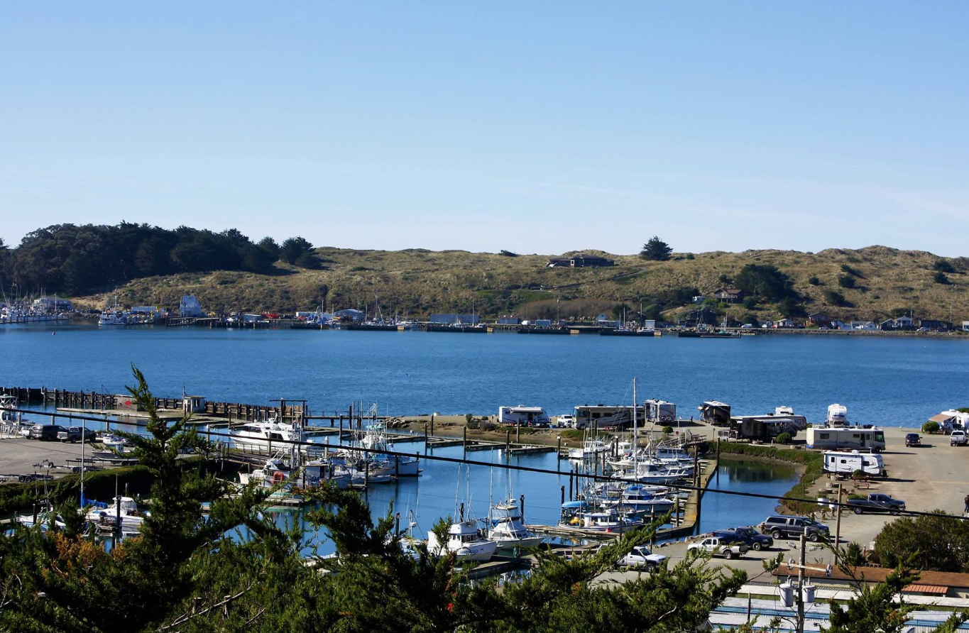 Bodega Bay harbor with fishing boats and dunes